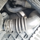 The hose in question is only a few inches long. It’s the big one underneath all of this clutter, with the shiny hose clamp.